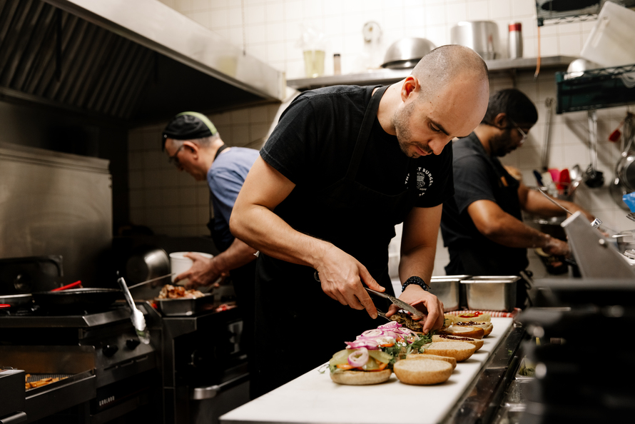 Olympus Burger Employees in Kitchen