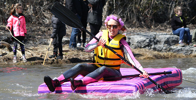 Pink crazy craft paddles down the Ganaraska River in Port Hope