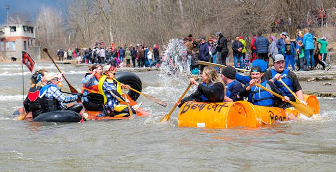 Group on a crazy craft in the rapids