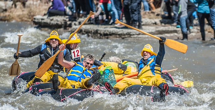 Group on a crazy craft in the rapids