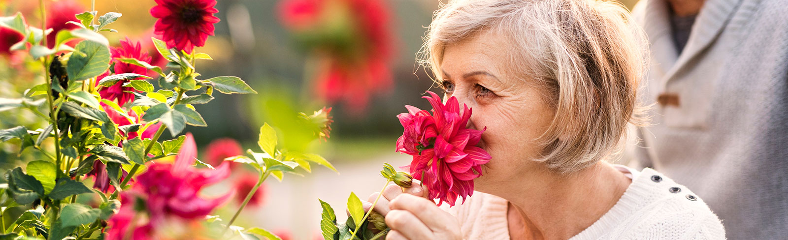 Woman smelling flowers