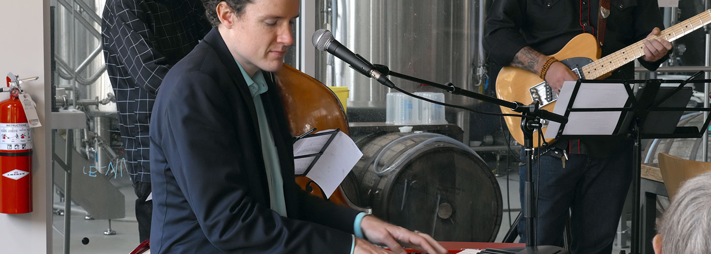 Man at piano with microphone