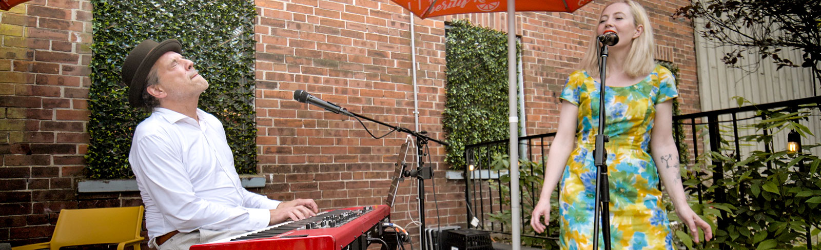 One keyboard player and a singer performing jazz