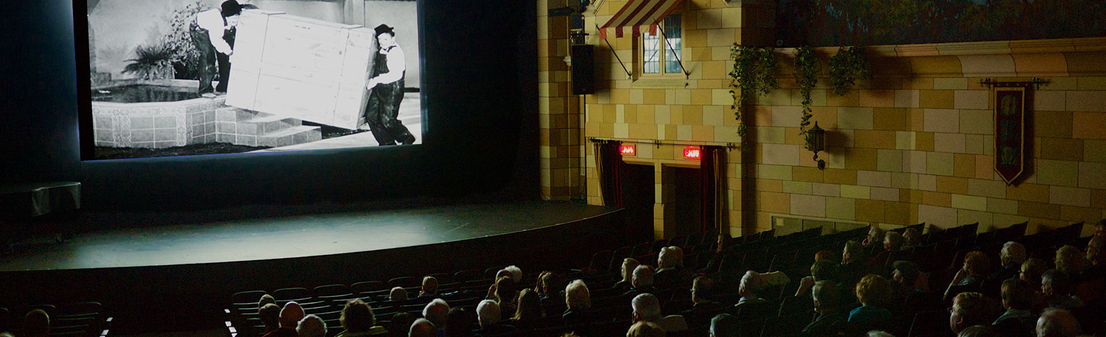 Crowd watching a vintage film in the Capitol Theatre in Port Hope