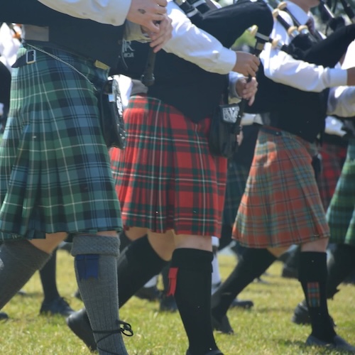 Pipers in kilts marching at the Northumberland Scottish Festival and Highland Games. 