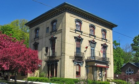 A historic building with trees on one side