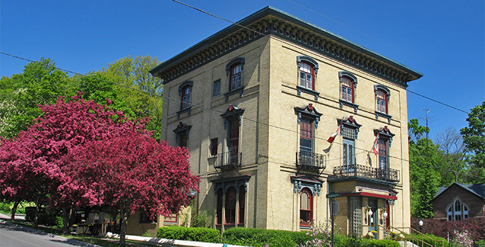 A historic building with trees on one side