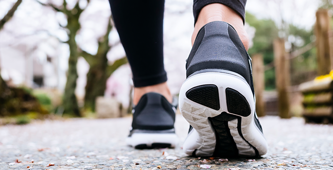 Running shoes on pavement