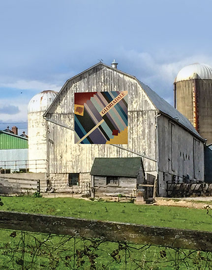 Couple reading the Barn Quilt Tour brochure