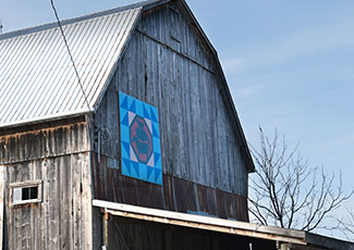 Barn in rural Port Hope with barn quilt tile