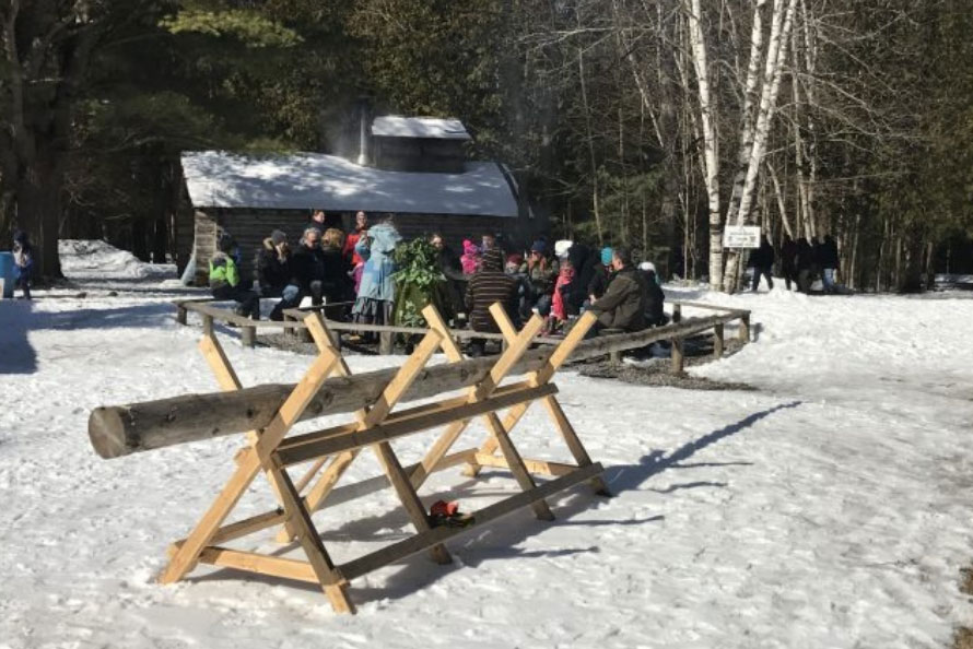 Guests huddled around the fire pit at the Ganaraska Forest Centre