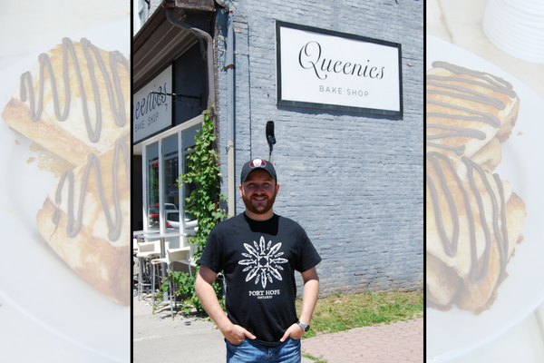 Adam the owner of Queenie's standing with his hands in pockets in front of the brick bake shop