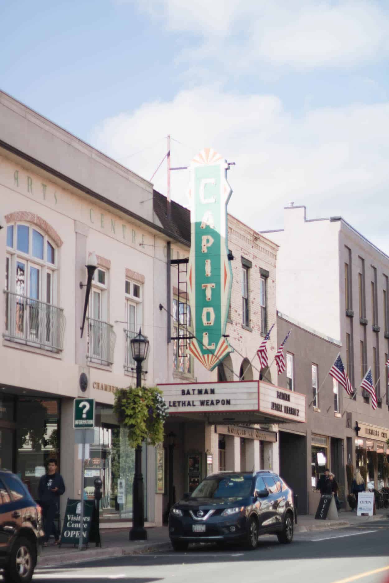 The Capitol Theatre building in downtown Port Hope with American Flags perched along the top