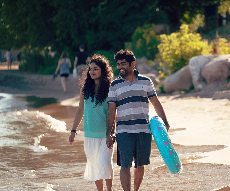 Couple enjoying the sandy Port Hope beach