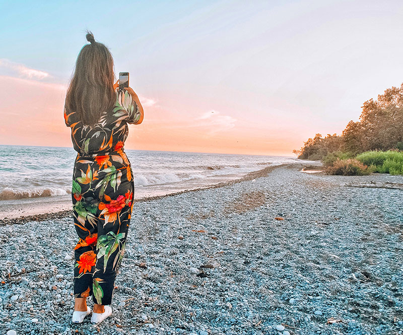 Woman on the beach during sunset
