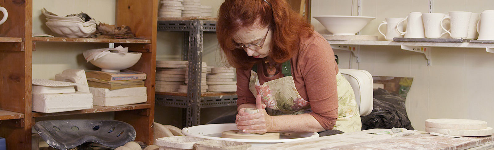 Pottery artist in her workshop