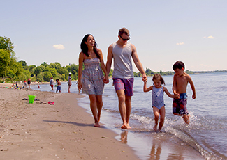A family consisting of a mother, father, and two small