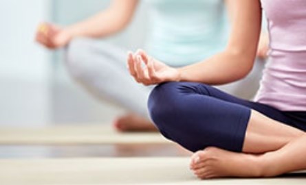 A woman doing yoga.