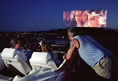 Group in a car watching a film at the Port Hope Drive-In